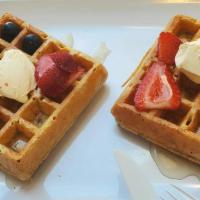 Waffles · Protein Waffles with strawberries and blueberries, syrup and butter.