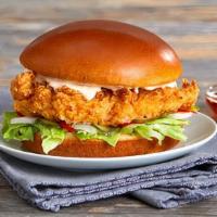 Fried Chicken Burger · Crisp chicken breast, chipotle mayonnaise, lettuce, white onions, and dill pickle served on ...
