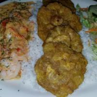 Camarones A La Tequila · Tequila shrimp with rice, salad and one side.