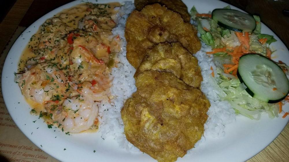 Camarones A La Tequila · Tequila shrimp with rice, salad and one side.