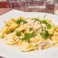 Tortellini Armetta'S · Cheese filled pasta rings in a light cream sauce with pancetta parmigiano.