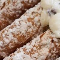 Cannoli · A crispy shell stuffed with ricotta filling chocolate chips.