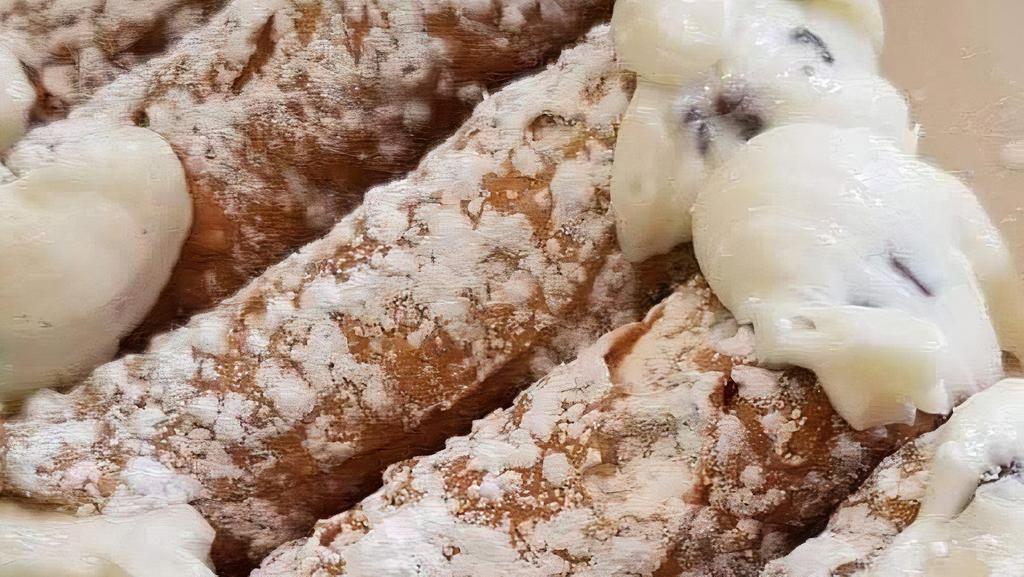 Cannoli · A crispy shell stuffed with ricotta filling chocolate chips.
