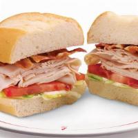 Turkey Club Combo · Sliced turkey breast with bacon, lettuce, tomatoes and mayonnaise on a toasted French roll.