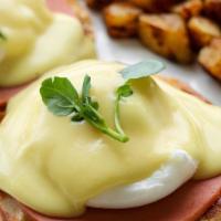 Eggs Benedict · Classic eggs benedict topped with one slice of Canadian bacon. Served with home fries and ho...