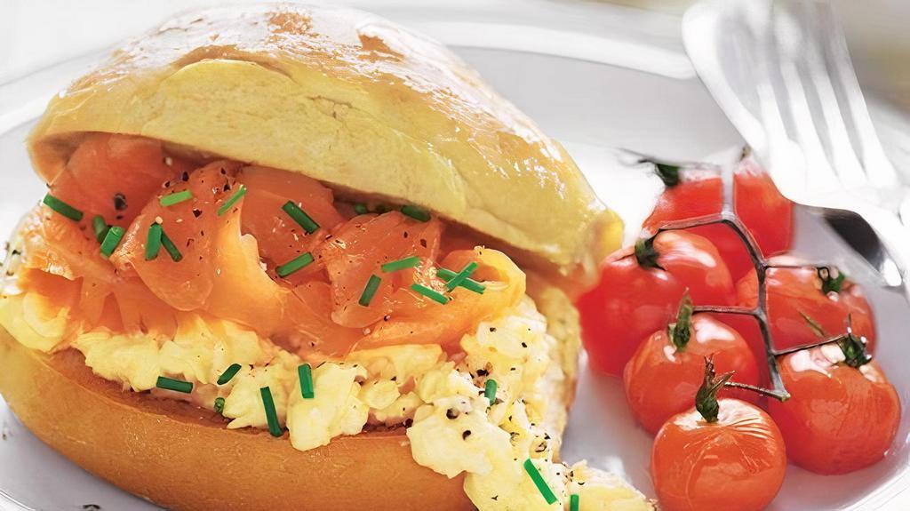 Egg, Smoked Salmon & Cheese Breakfast Sandwich · Two scrambled eggs with cheddar cheese and smoked salmon on a buttered brioche bun.