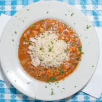 Crawfish Etouffee · crawfish, onions, tomato sauce, celery, peppers & cajun seasoning simmered for hours served ...