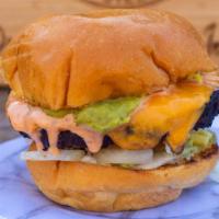 Blackbean Sizz · Black bean burger topped with American cheese, shredded lettuce, tomato, diced onion, pickle...
