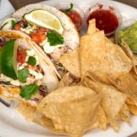 Fish Tacos · Grilled mahi with fresh pico de gallo, lime mayo and shredded cabbage on your choice of flou...
