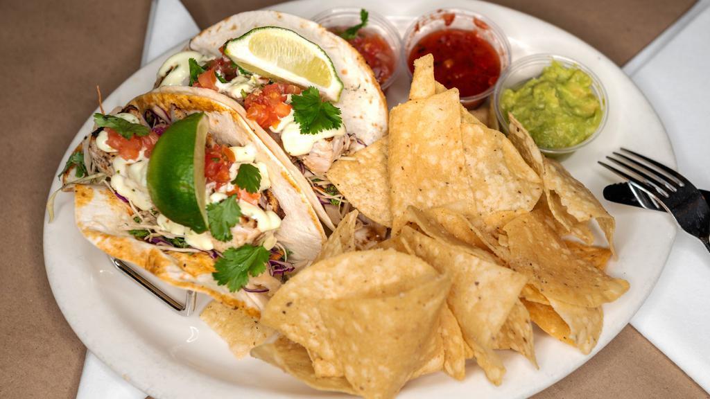 Fish Tacos · Grilled mahi with fresh pico de gallo, lime mayo and shredded cabbage on your choice of flour or white corn tortilla. Served with guacamole and salsa