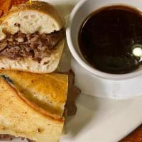 Irish Dip · Shaved angus prime rib on a fresh baked, grilled baguette. Served with au jus.
