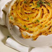 Shepherd'S Pie · Ground sirloin and diced vegetables in savory gravy, baked with a champ mashed crust.