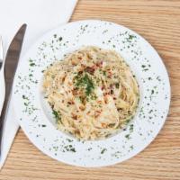 Fettuccine Alfredo · Cream sauce, Parmesan. Add salad, chicken for an additional charge.