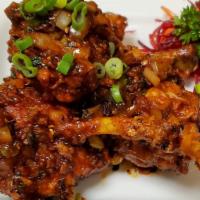Chicken Lollipop · Marinated chicken, onion, garlic, and ginger in medium spicy sauce