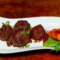 Dry Vegetable Manchurian · Minced vegetable balls with garlic, ginger and coriander in medium spicy sauce