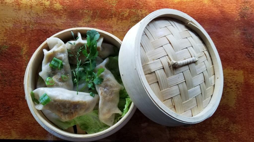 Vegetable Dumpling · Minced vegetables & cottage cheese in a wrap, steamed & sauteed