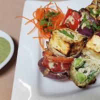 Paneer Tikka Achaari · Cottage cheese slices marinated in pickled flavor cooked in clay oven.