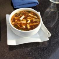 Manchow Vegetable · Popular Indo Chinese soup with soya base , mushroom, carrot , baby corn & basil