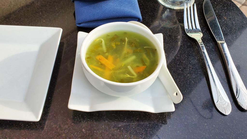 Lemon Coriander Veg Soup · Golden mushrooms, carrots, and bean sprout in a lemon flavored broth