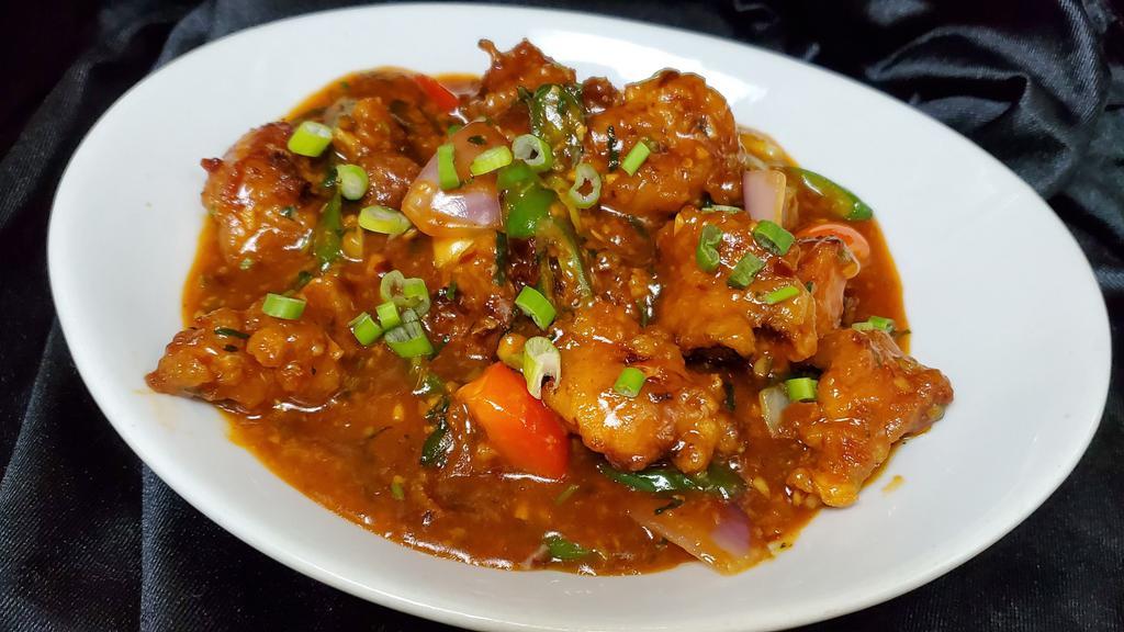 Hakka Chili Fish  · Tilapia fish in chili sauce with bell peppers onion and scallions