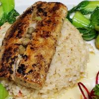 Mahi-Mahi · Grilled Mahi Mahi in a butter sauce served with capers bok choy and risotto with sundried to...