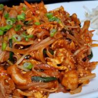 Pad Thai · Veg medium flat rice noodles with onions, chives and tamarind sauce. Vegetable pad Thai has ...