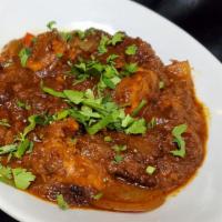 Chicken Kadhai  · Chicken curry with boneless chicken pieces served in thick gravy along with big chunky piece...
