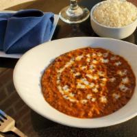 Dal Makhani  · Black Lentils cooked in slow fire overnight, finished with butter and tomato gravy