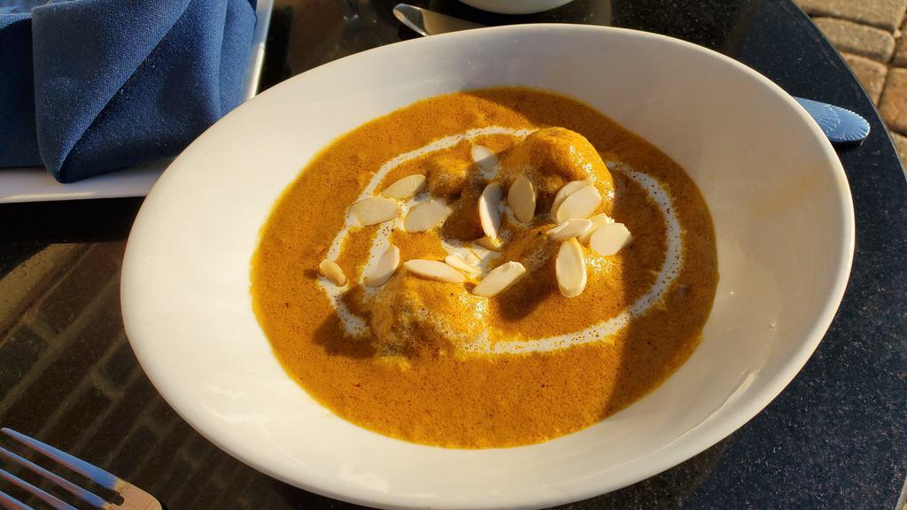 Malai Kofta · Cottage cheese & cashew dumpling infused with spices & raisin simmered in creamy sauce