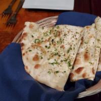 Garlic Naan · Leavened bread with topping.