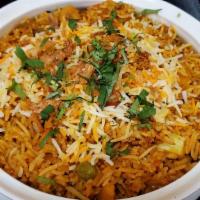 Vegetable Biryani · Mixed vegetable cooked with basmati rice flavored with exotic spice.