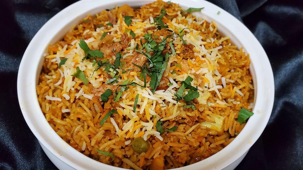 Vegetable Biryani · Mixed vegetable cooked with basmati rice flavored with exotic spice.