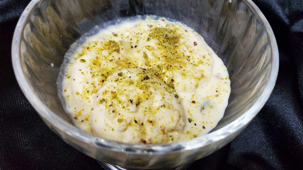 Rasmalai · Condensed milk patty in a creamy sauce.