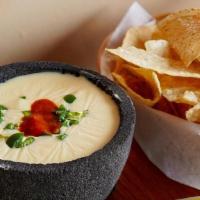 Queso Dip · Creamy queso dip. Served with tortilla chips.