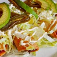 Flautas · Four rolled up and deep fried tortillas stuffed with chicken and cheese, topped with queso f...