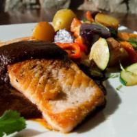 Salmon Dona Tibe · Pan seared salmon fillet (6oz). Served with mole Oaxaca, rice, vegetables and tortillas.