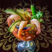 Coctel De Camarones · Classic Mexican cocktail with jumbo shrimp, clamato juice, tomato sauce, avocado, onions and...
