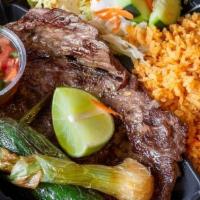 Carne Asada · Grilled marinated skirt steak, served with rice and a side salad, pico de gallo, jalapeno to...