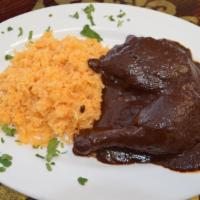 Mole Con Pollo · Our delicious and traditional mole Oaxaca. Served with two pieces of chicken, rice, beans an...