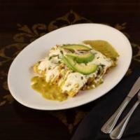 Enchiladas Suizas · Three soft corn tortillas rolled and stuffed with cheese, chicken topped with our creamy tom...