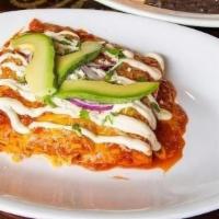 Enchiladas Rojas · Three soft corn tortillas rolled and stuffed with cheese, ground beef, our special homemade ...