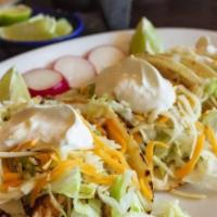 Tex Mex Tacos · Tex-Mex style tacos made with flour tortillas, choice of protein, lettuce, mexican cheese an...