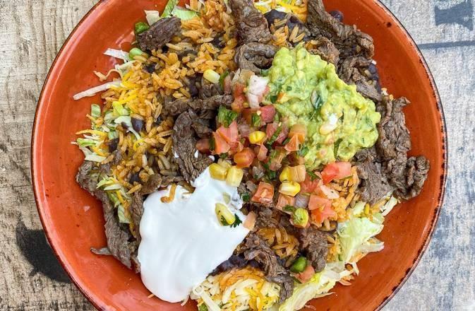 Burrito Bowl · Bowl stuffed with rice, fried black beans, Monterrey Jack cheese, choice of protien. Served with salad, pico de gallo, guacamole and sour cream.