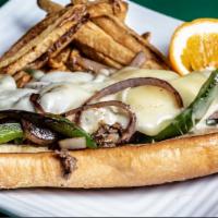 The Philly Cheesesteak · Thinly sliced ribeye steak with grilled onions, bell peppers and provolone cheese on an Ital...