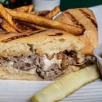 The Steak Melt · Thinly sliced ribeye steak, grilled onions, bacon and melted cheese. Served on a jalapeño Ch...