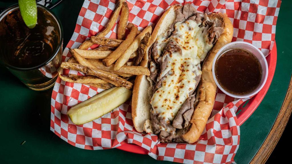 The Italian Beef · Thinly sliced roast beef in Italian gravy topped with mozzarella cheese on a French roll (sweet peppers or hot giardiniera upon request).
