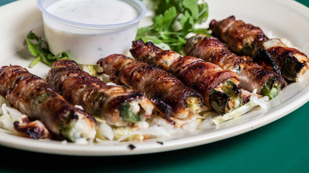 Handmade Stuffed Jalapeños · Stuffed with shrimp, crab and Pepper Jack cheese wrapped in bacon and served with ranch dressing.