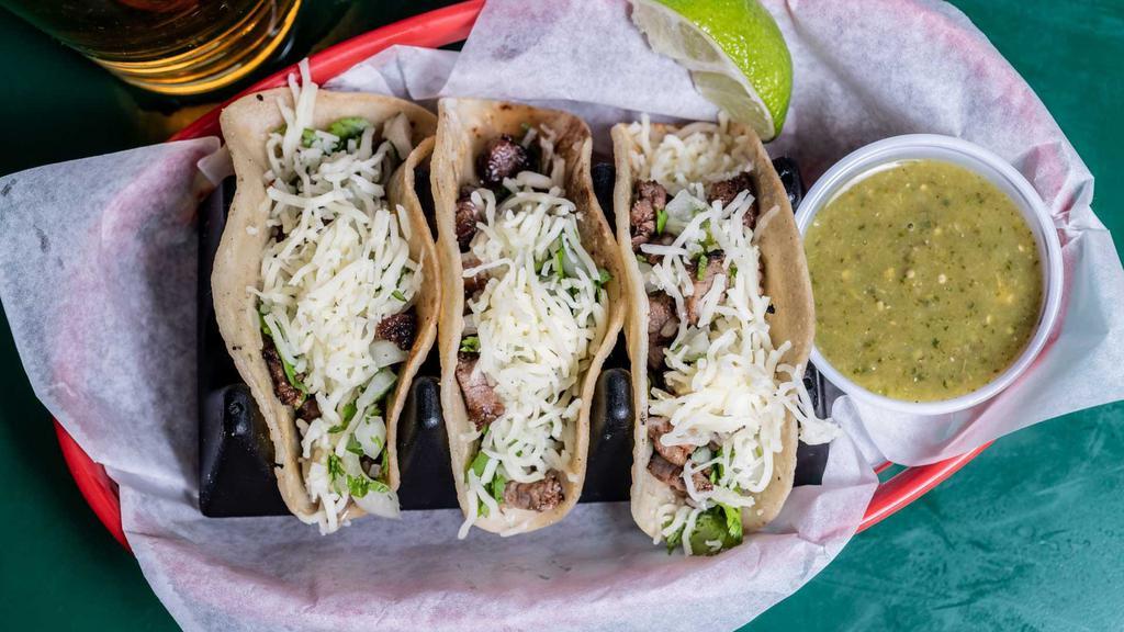 Street Tacos · Steak or chicken with cilantro, onion and Jack cheese on corn tortillas.