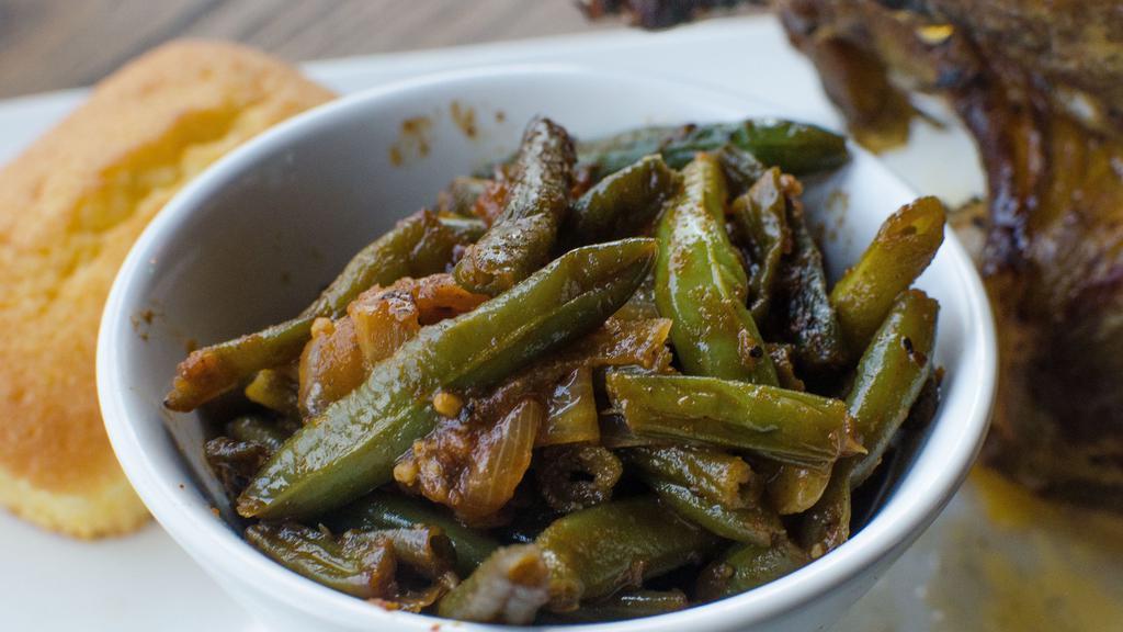 Green Beans · Fresh green beans, blanched and sautéed with onions, then seasoned to perfection.