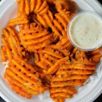 Buffalo Fries · Seasoned fries tossed in our Buffalo sauce and served with a side of ranch dressing.
